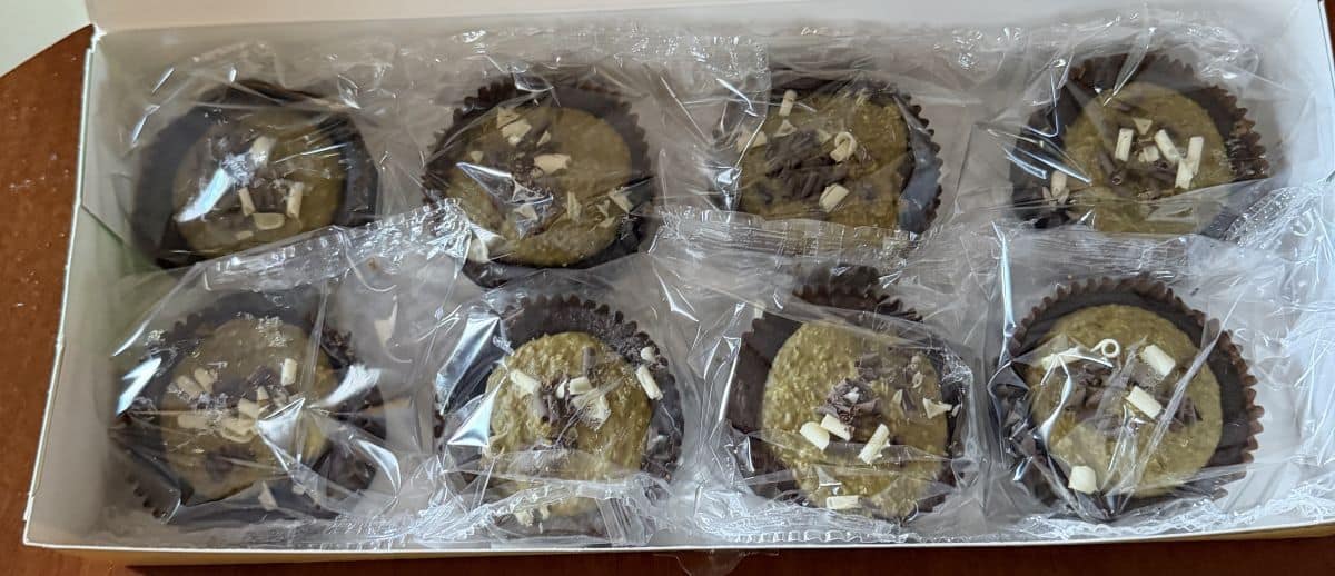 Image of eight individually wrapped Dubai style brownies sitting in a box.
