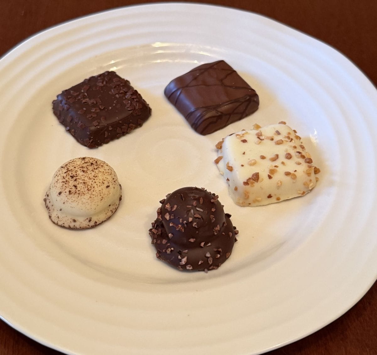 Image of five biscuits served on a white plate.