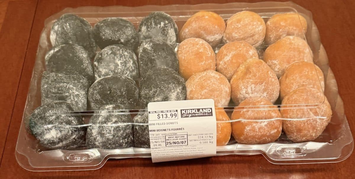 Image of the Costco Kirkland Signature Mini Filled Donuts container sitting on a table unopened.