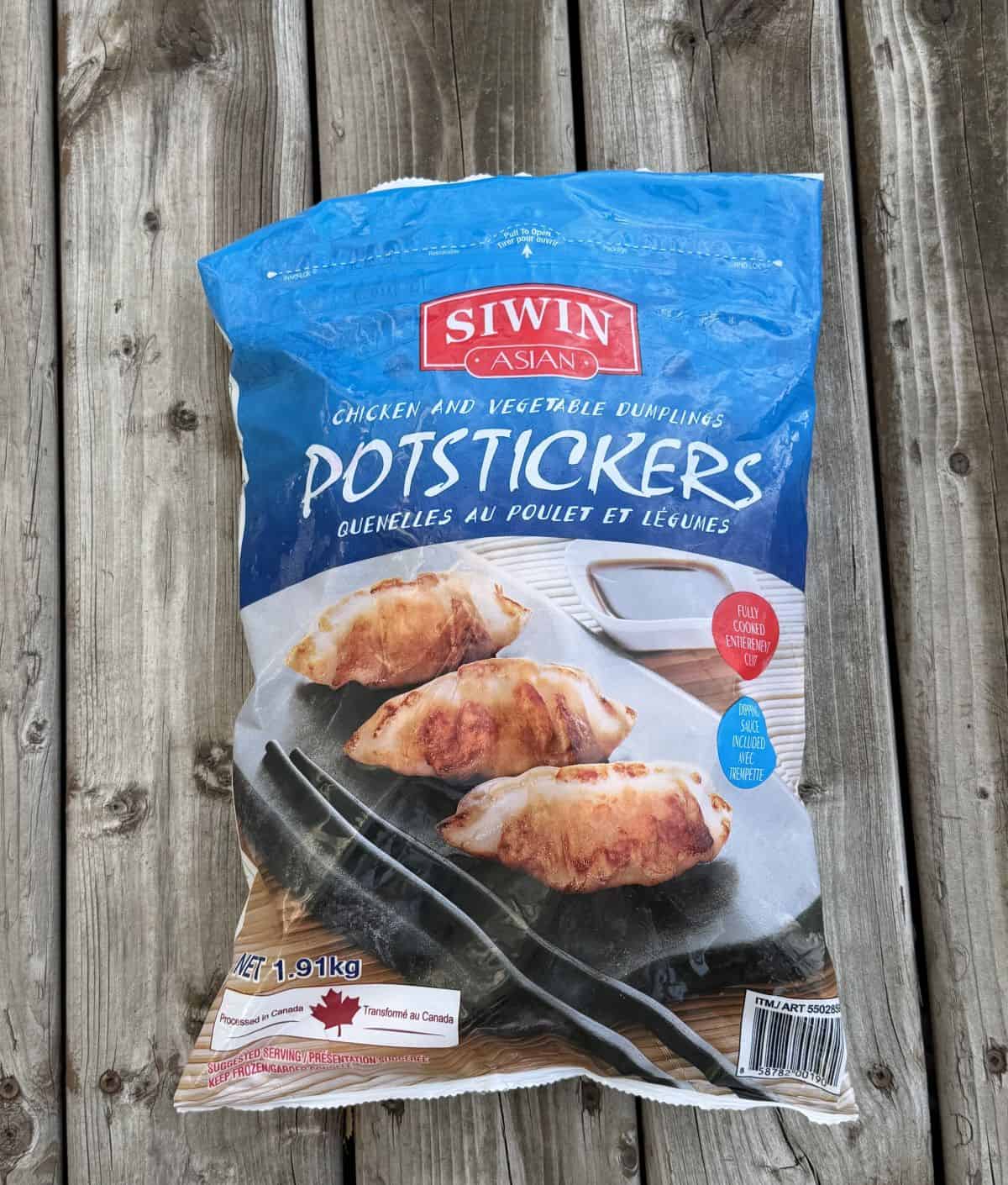 Costco Siwin Chicken and Vegetable Potstickers bag sitting on a table unopened. 
