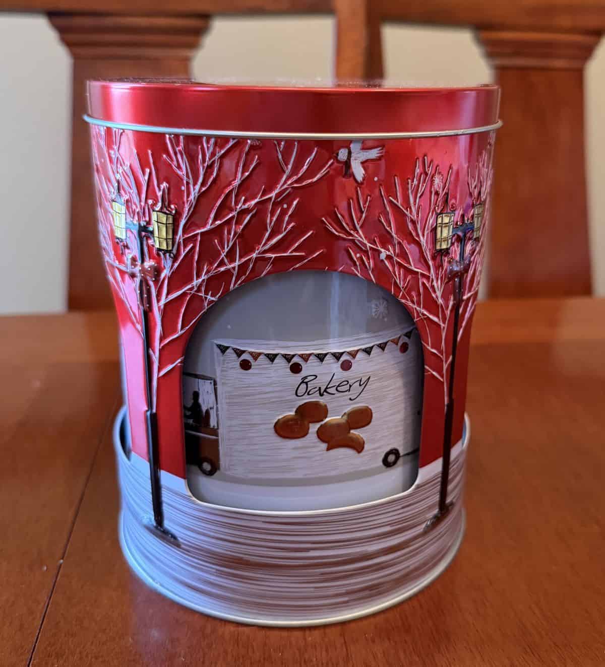 Image of the Costco Stockmeyer Rotating Music Tin with Caramel Filled Butter Biscuits sitting on a table unopened.