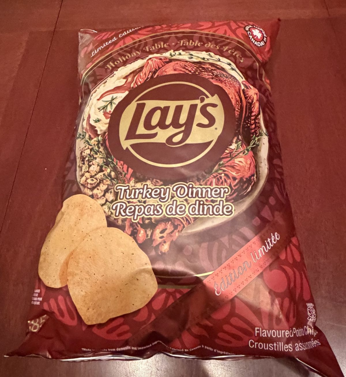 Image of the Costco Lay's Turkey Dinner Potato Chips bag sitting on a table unopened.
