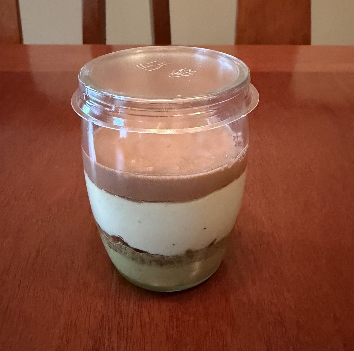 Image of one unopened dessert sitting on a table unopened.