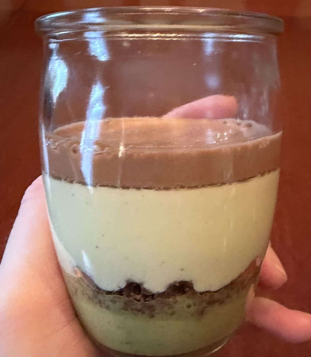 Closeup image of the pistachio chocolate dessert so you can see all the different layers.