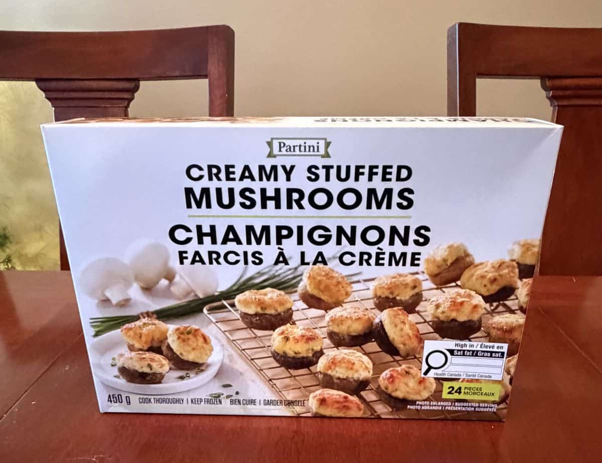 Image of the Costco Partini Creamy Stuffed Mushrooms box sitting on a table unopened.