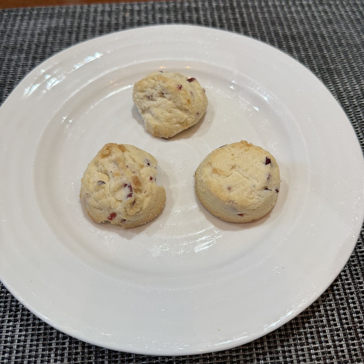 Image of three shortbread cookies served on a white plate.