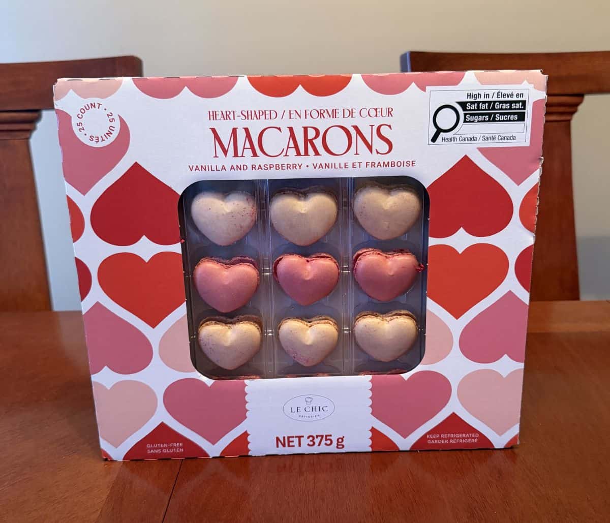 Image of the Costco Le Chic Patisserie Heart-Shaped Macarons box sitting on a table unopened.