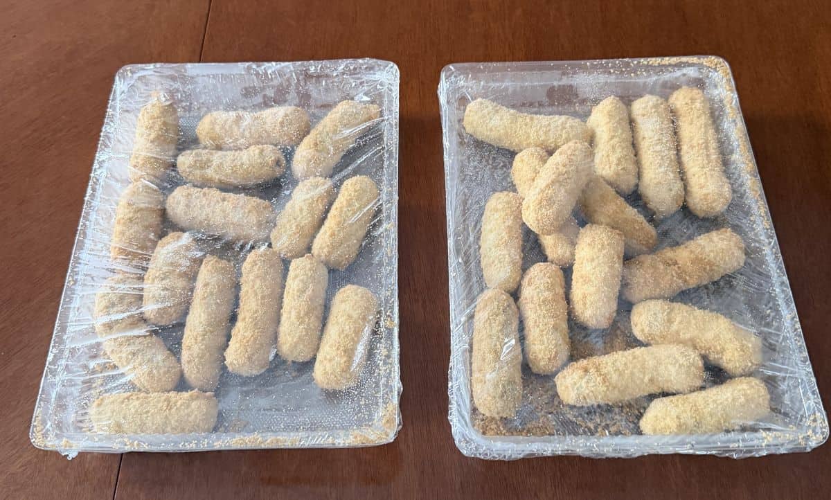 Image of two packages of blueberry & brie bites that come inside the box. The packages are sealed and there are fifteen in each pack.