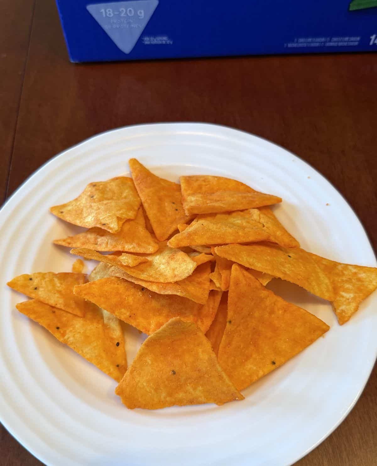 Image of a plate of nacho cheese Quest protein chips.