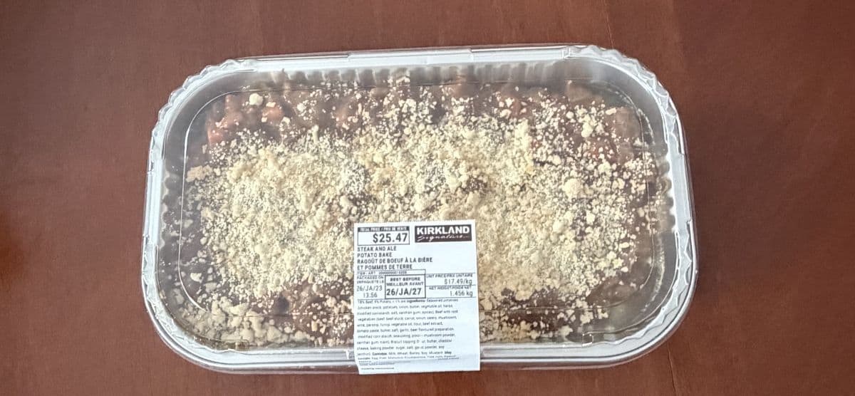 Image of the Costco Kirkland Signature Steak and Ale Potato Bake sitting on a table unopened.