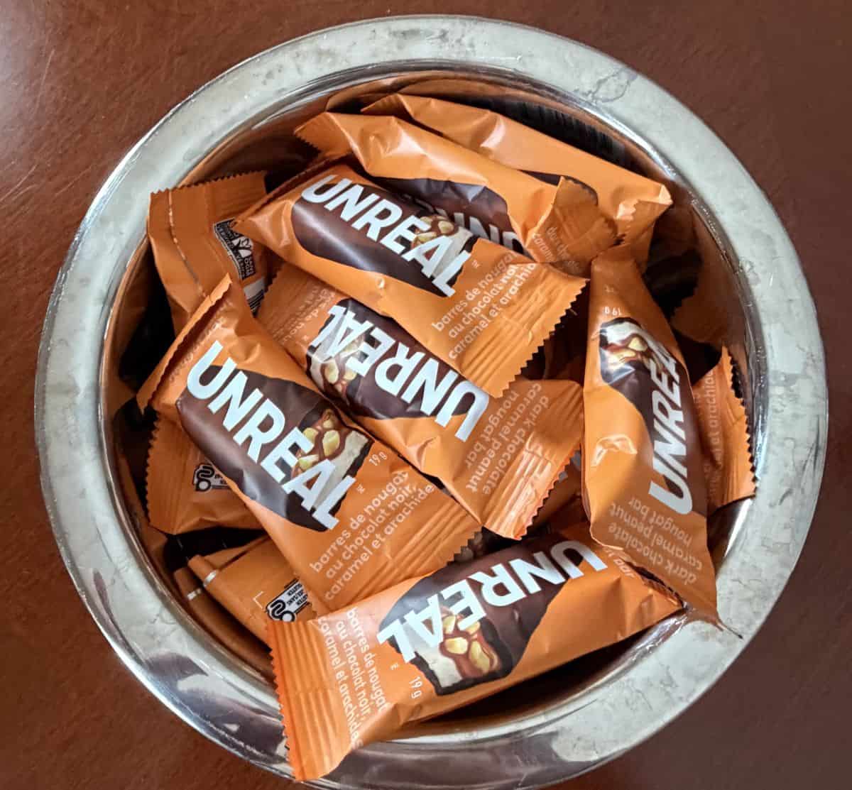 Image of a bowl full of the Costco Unreal Dark Chocolate Peanut Nougat Bars.