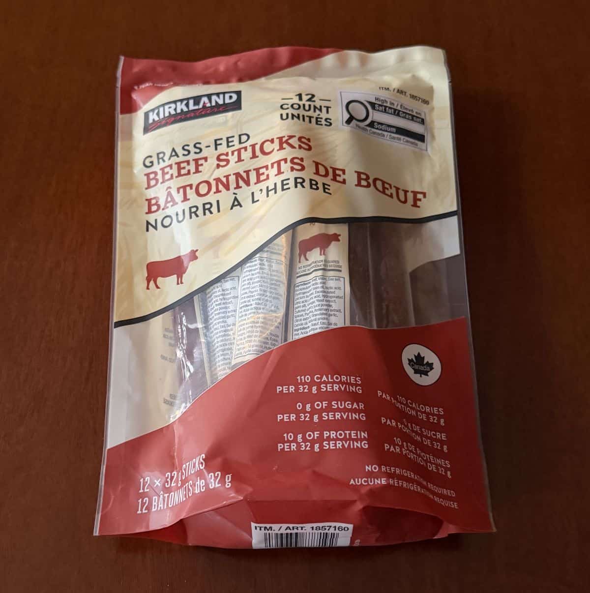 Image of the Costco Kirkland Signature Grass-Fed Beef Sticks package sitting on a table unopened.