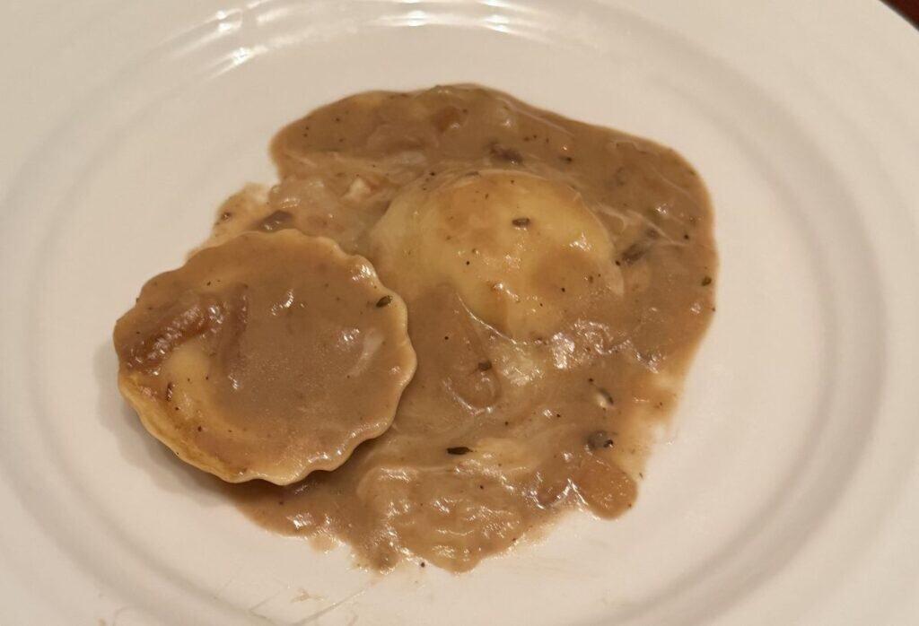 Image of the ravioli served on a white plate.