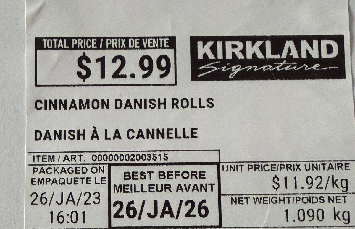 Closeup image of the cinnamon danish rolls label showing the best before date and cost.