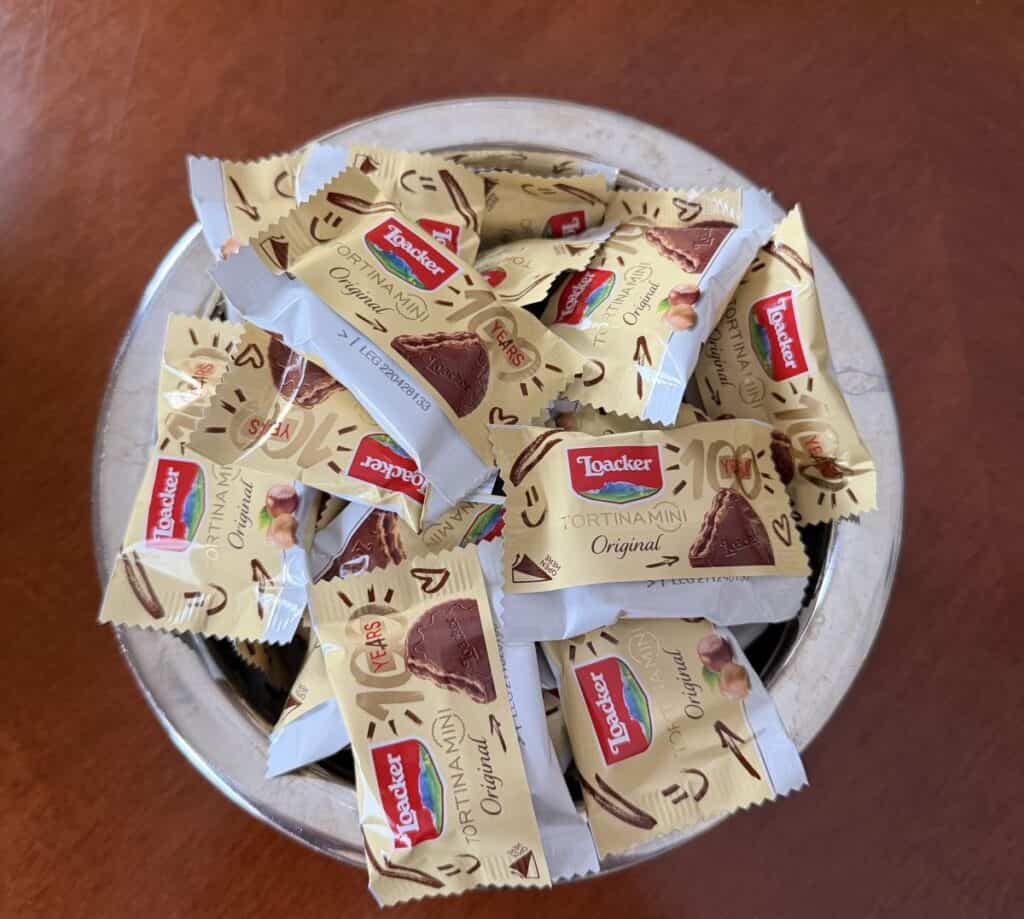 Top down image of a bowl full of individually packaged Loacker Tortina Mini Original.