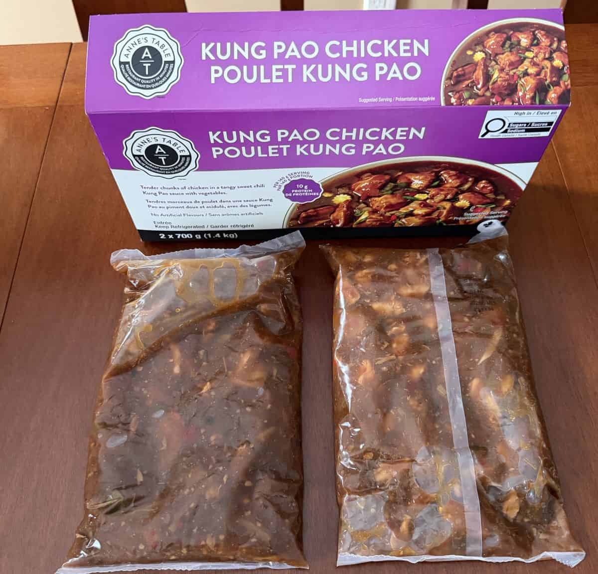 Image of the kung pao chicken package contents outside the box unopened on a table.