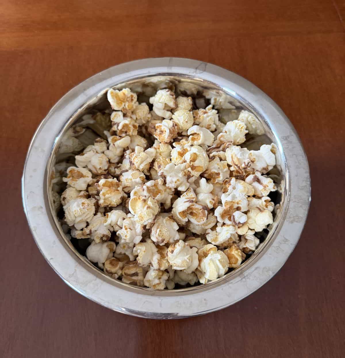 Top down image of a bowl of Reese's popcorn.