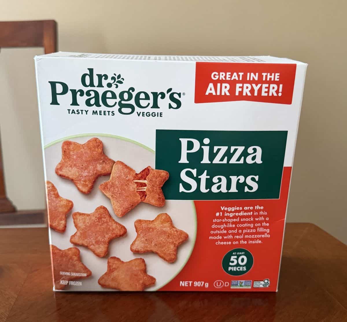 Image of the Costco dr. Praeger's Pizza Stars box sitting on a table unopened.