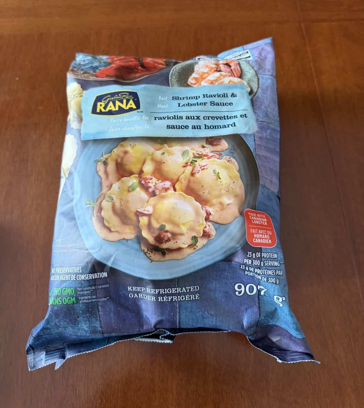 Image of the Costco Rana Shrimp Ravioli & Lobster Sauce pasta kit sitting on a table unopened.