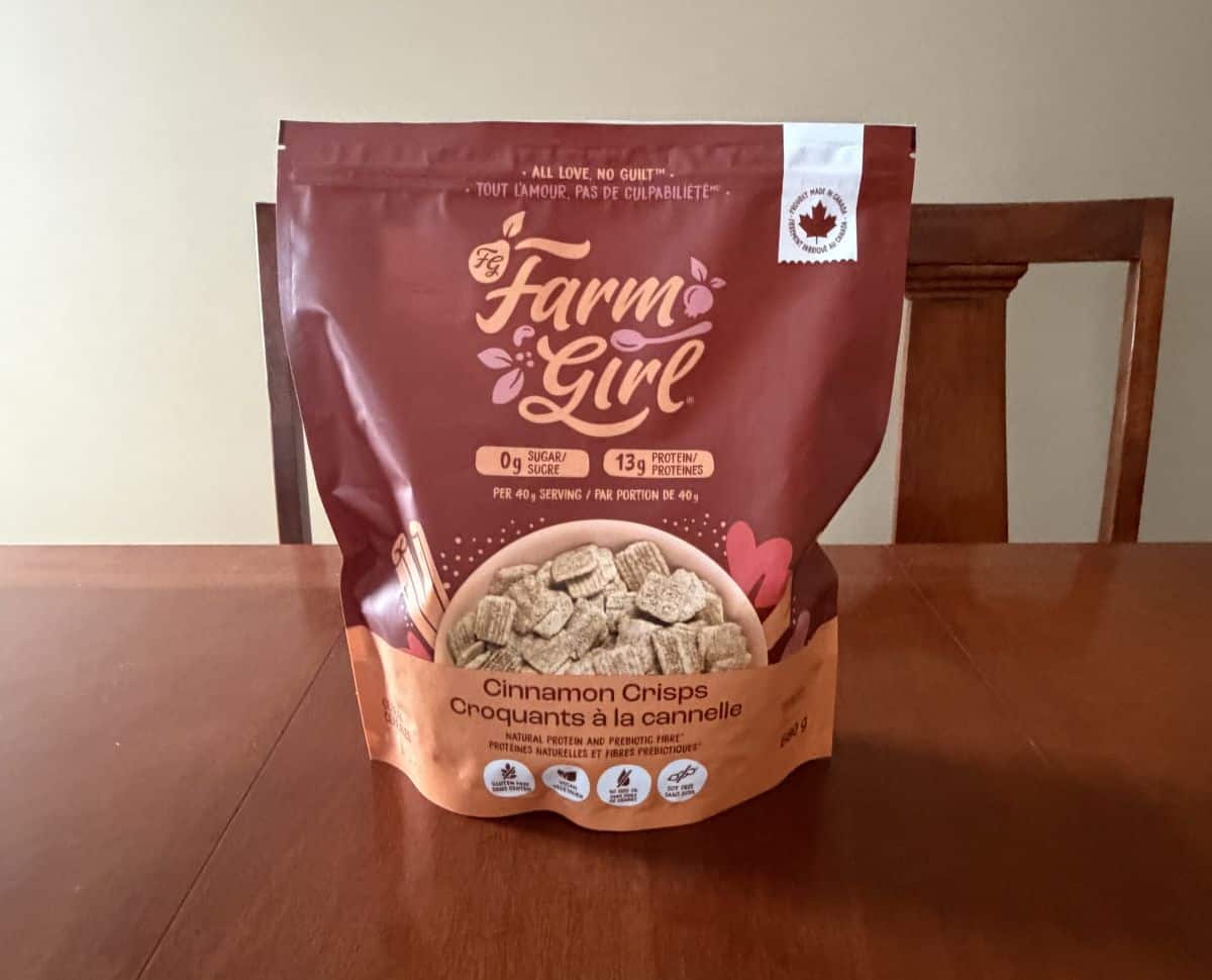 Image of the Farm Girl Cinnamon Crisps Cereal bag sitting on a table unopened.
