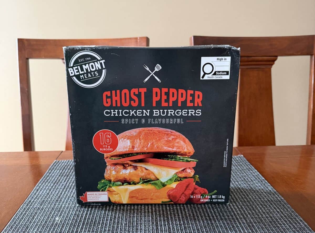 Image of the Costco Belmont Meats Ghost Pepper Chicken Burgers box sitting on a table unopened.