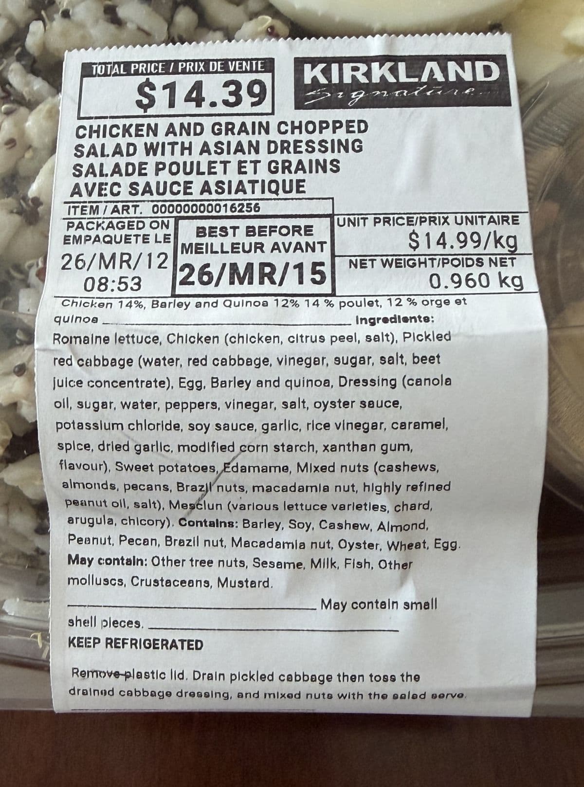 Closeup image of the front label on the salad showing best before date, cost and ingredients.