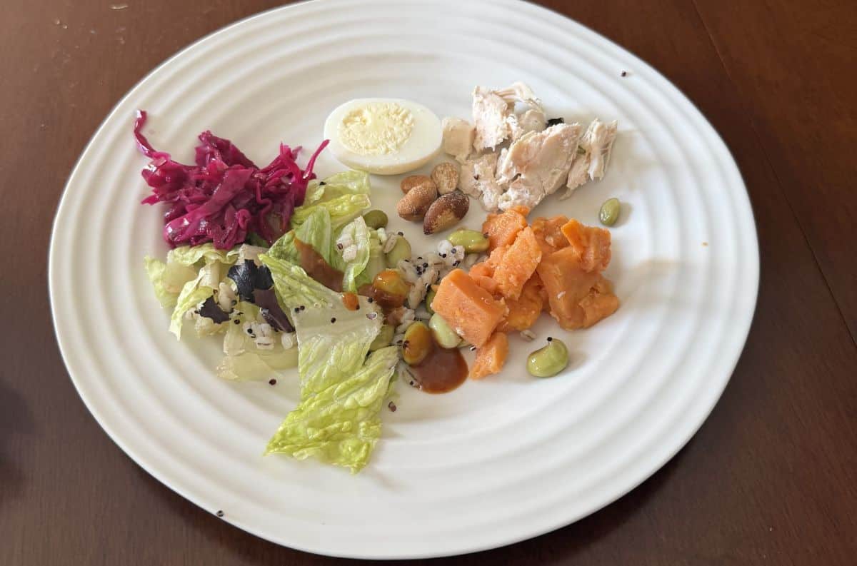 Sideview top-down image of the salad served on a white plate.