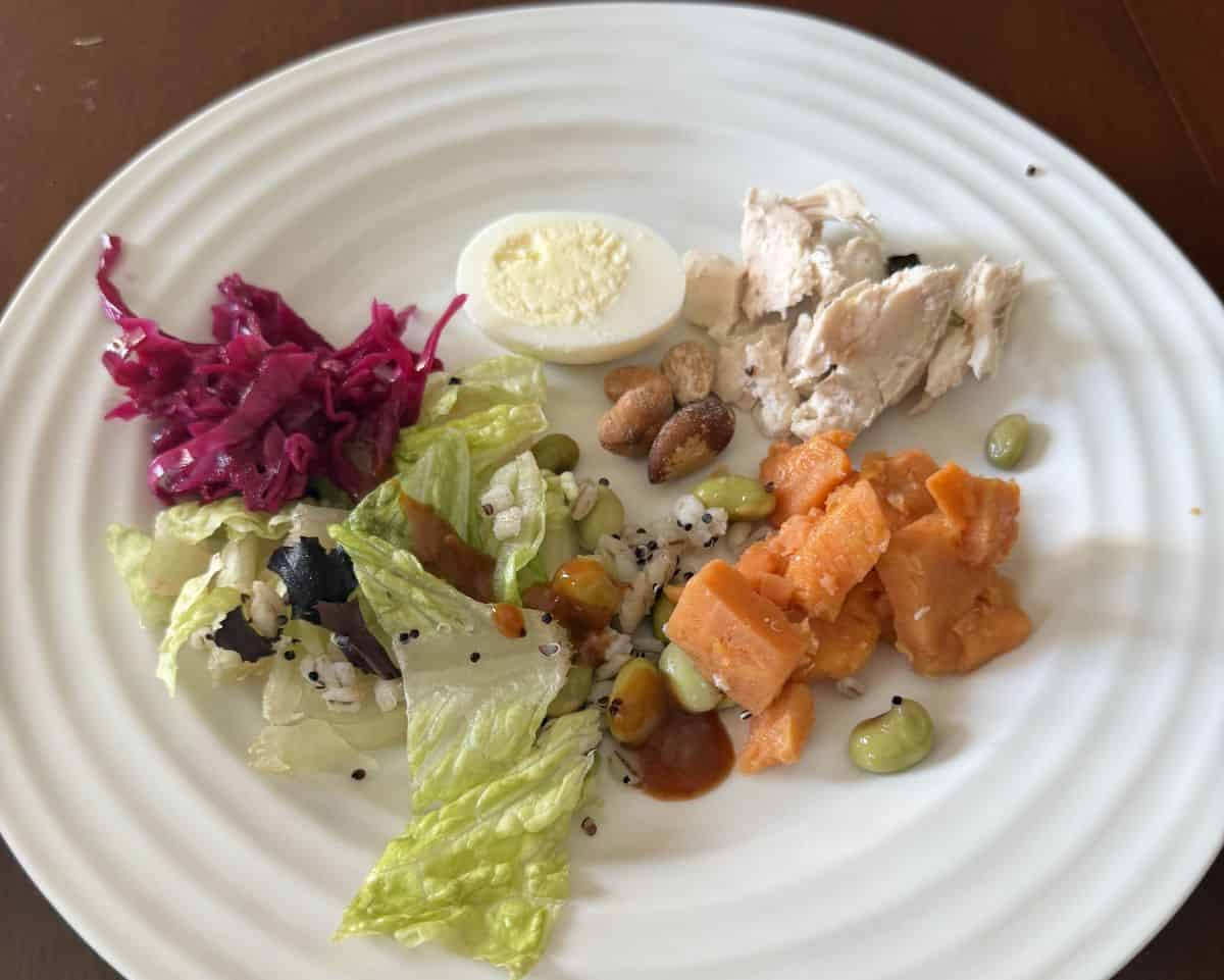 Closeup top-down image of the salad served on a white plate.
