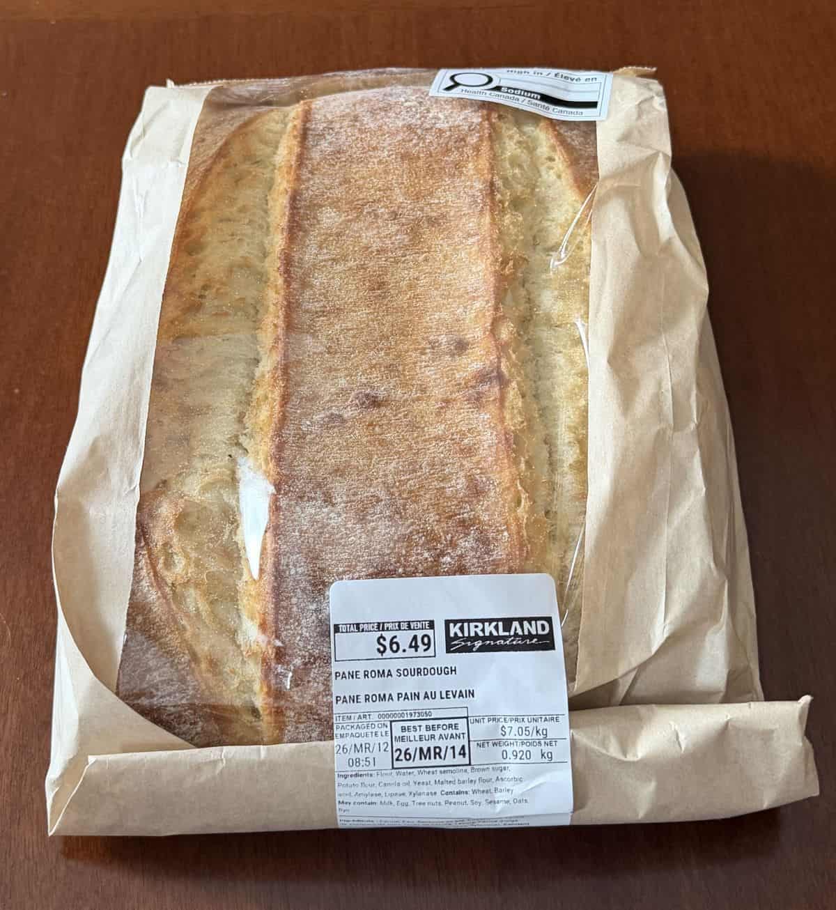 Image of the Kirkland Signature Pane Roma Sourdough sitting on a table unopened.