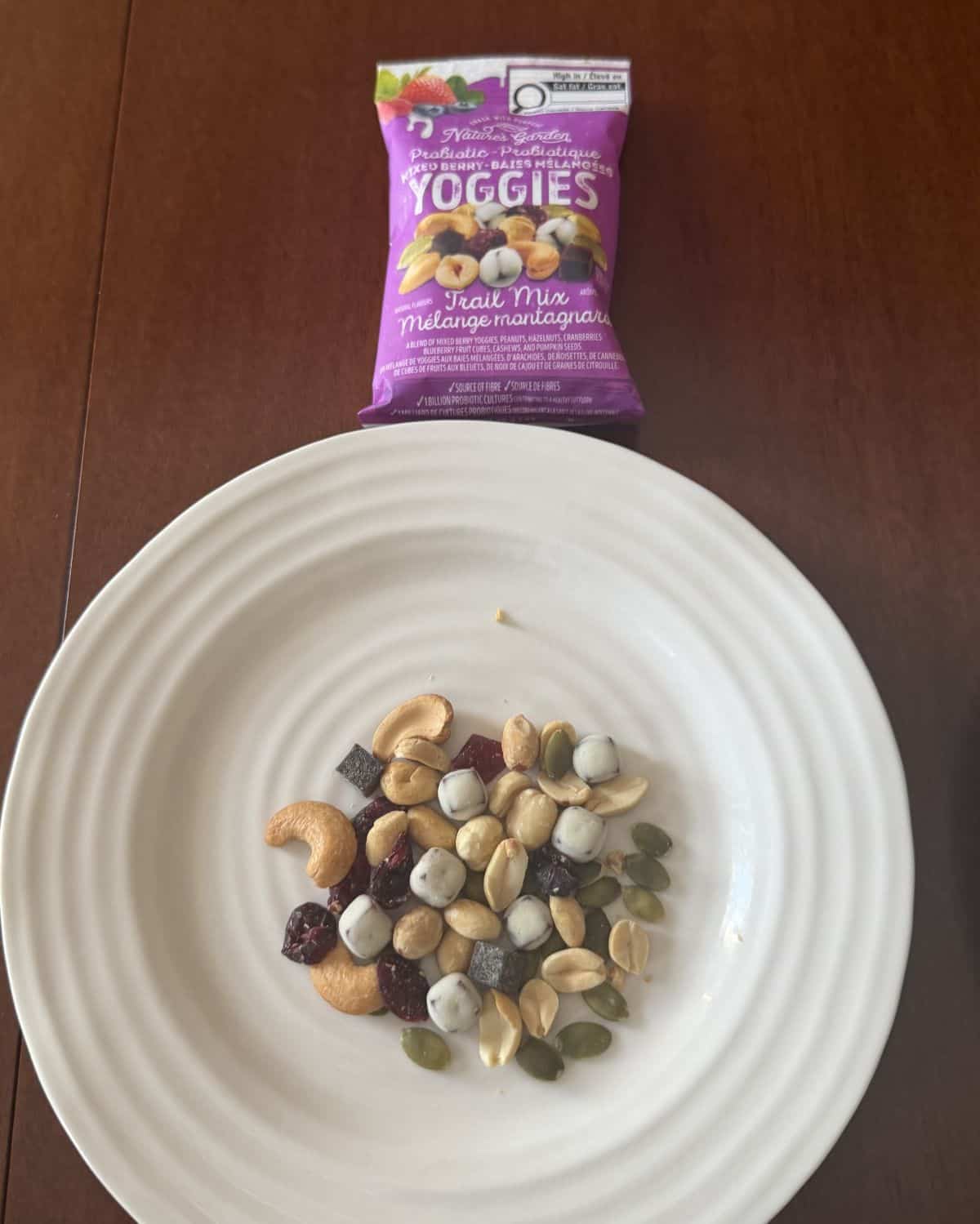 Top down image of the mixed berry trail mix served on a white plate.