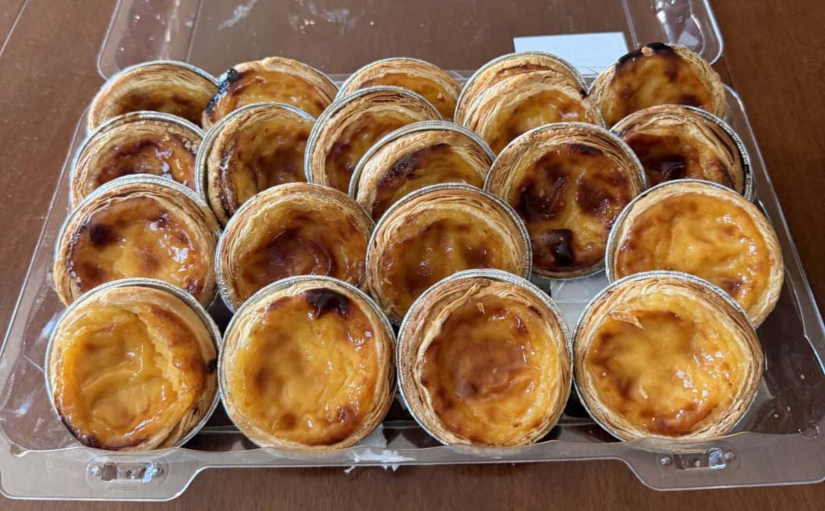 Image of the open pack of Kirkland Signature Portuguese Custard Tarts showing 20 tarts.