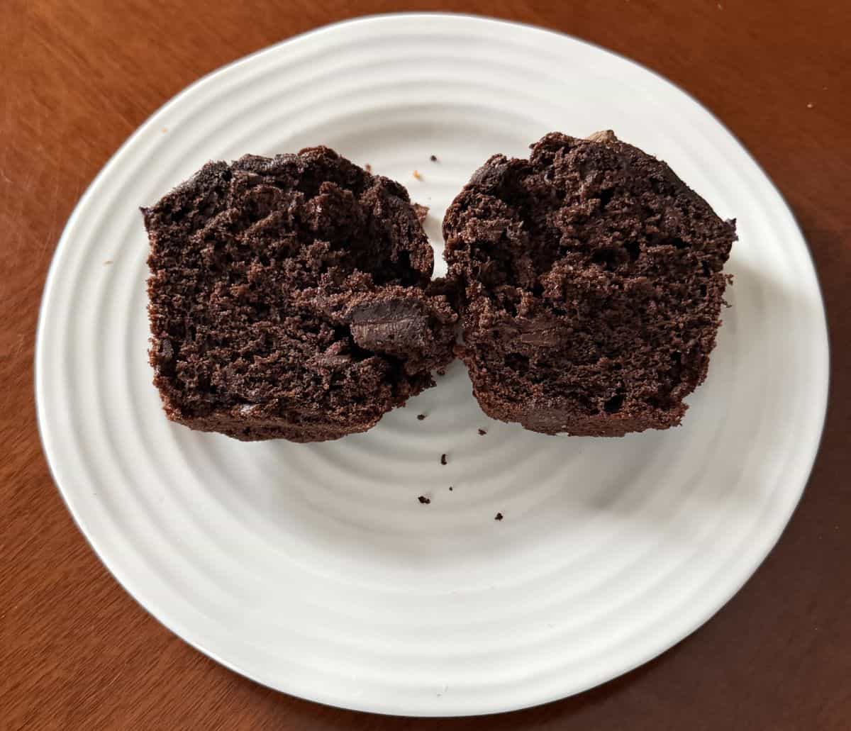 Image of one double chocolate muffin cut in half so you can see the inside of the muffin.