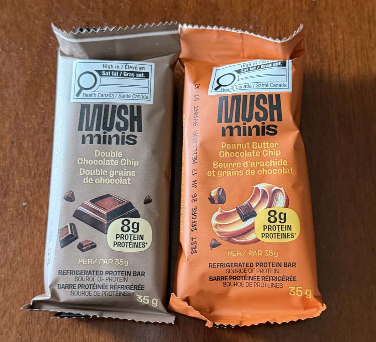 Image of two mush minis in their wrappers sitting on a table.