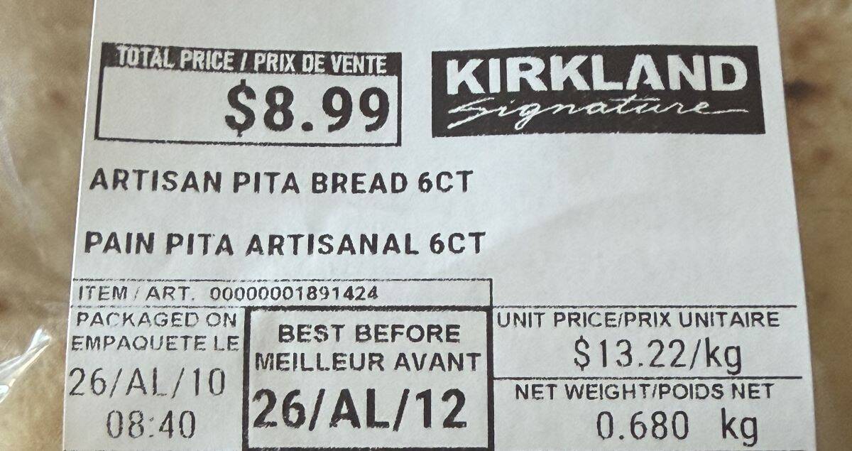 Image of the front label on the pita bread showing the cost and best before date.