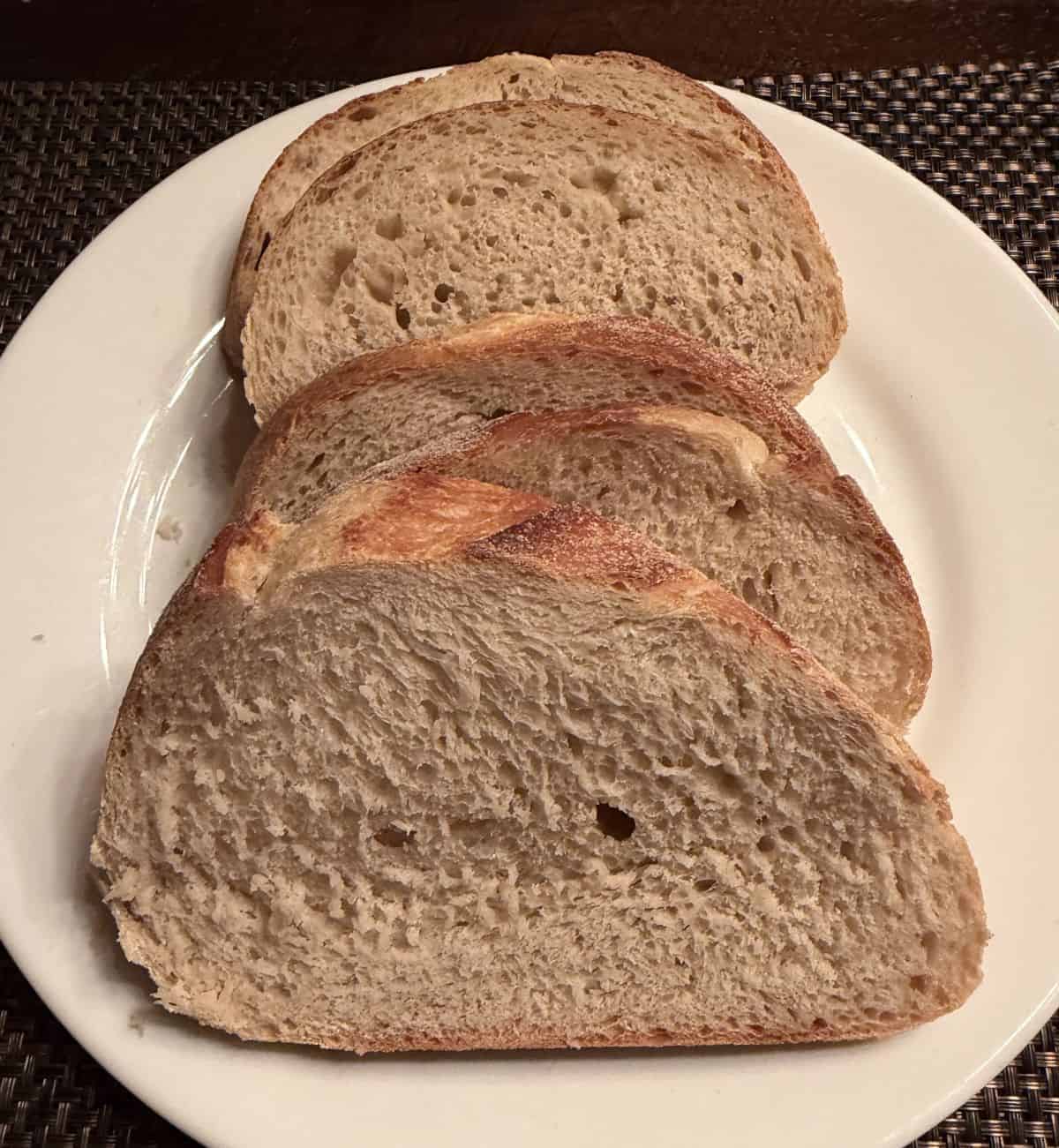 Image of the bread sliced and served on a white plate.