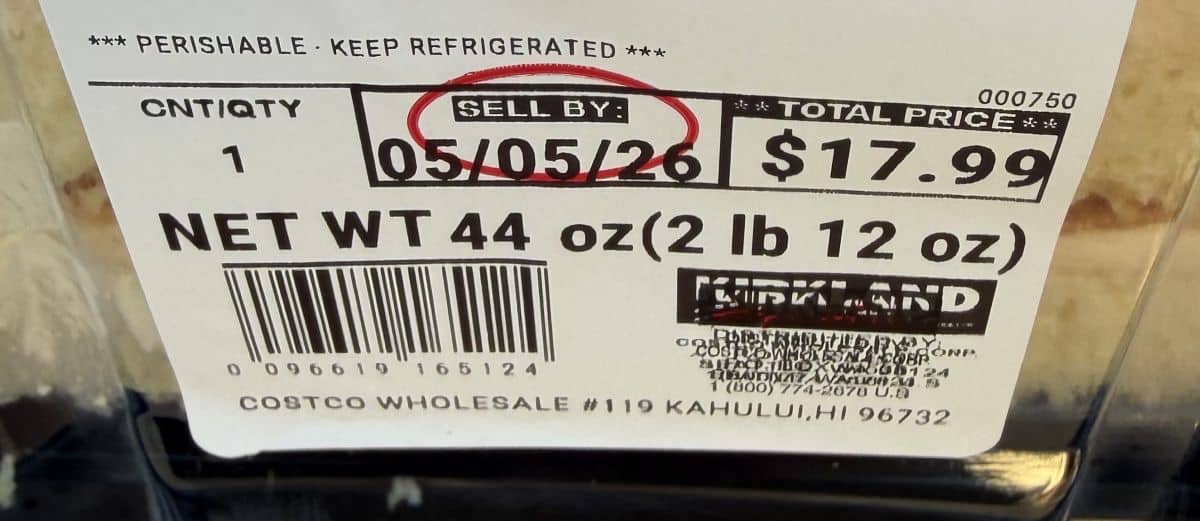 Closeup image of the front label on the cake showing cost and sell by date.