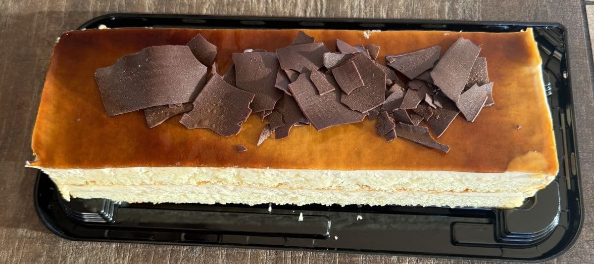 Top down image of the entire Tres Leches Bar Cake with the lid off so you can see the entire top of the cake.