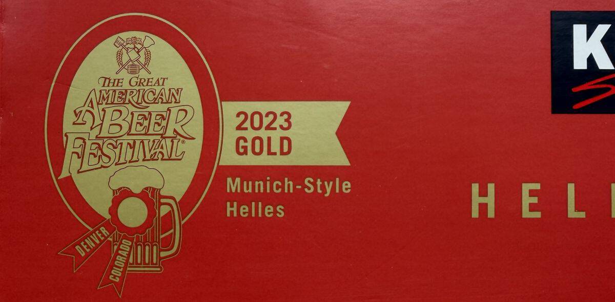 Image of a gold award that the beer one in a beer content that's on the box.