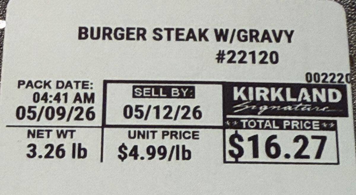 Closeup image of the label on the Burger Steak with Gravy Meal showing the sell by date and total price.