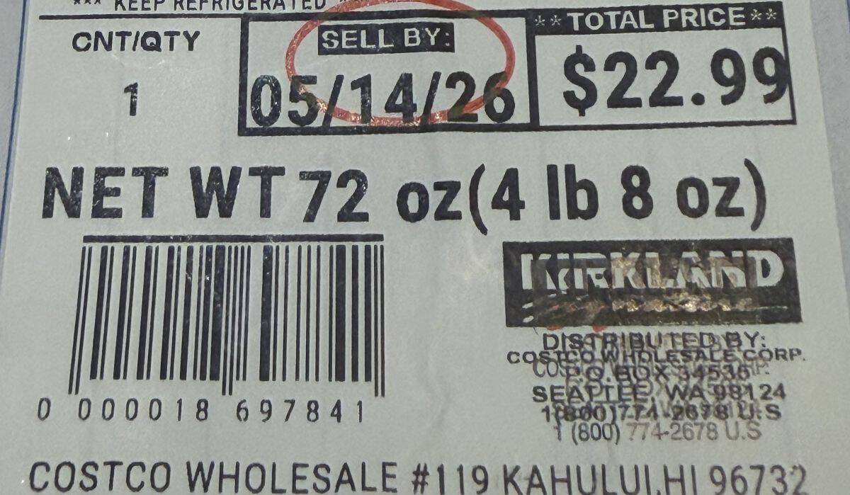Image of the label on the cheesecake showing the cost and sell by date.