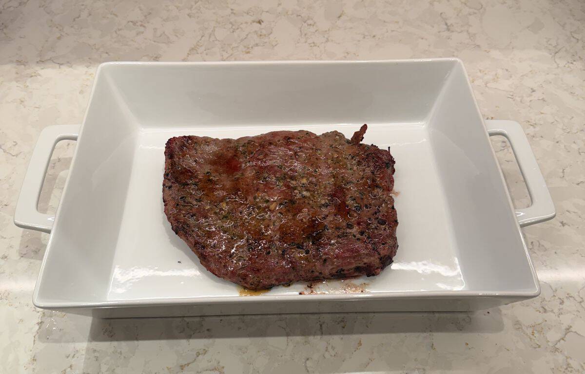 Image of the flank steak after being grilled, there is no marinade on it yet.