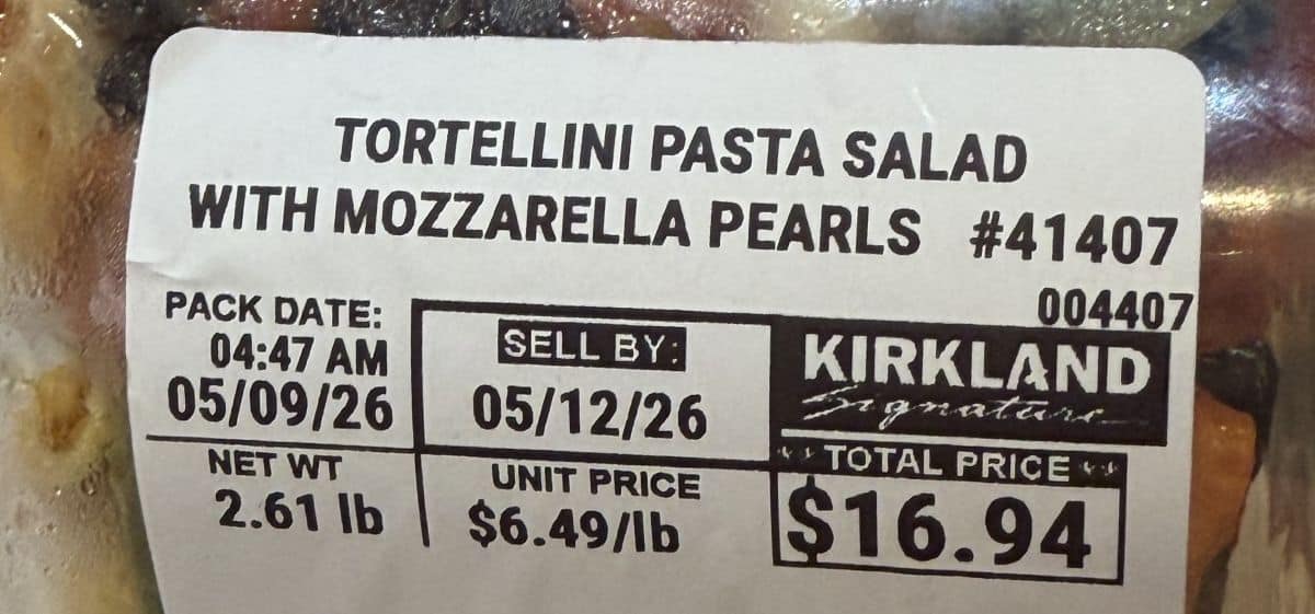Image of the front label on the pasta salad showing the sell by date and the cost.