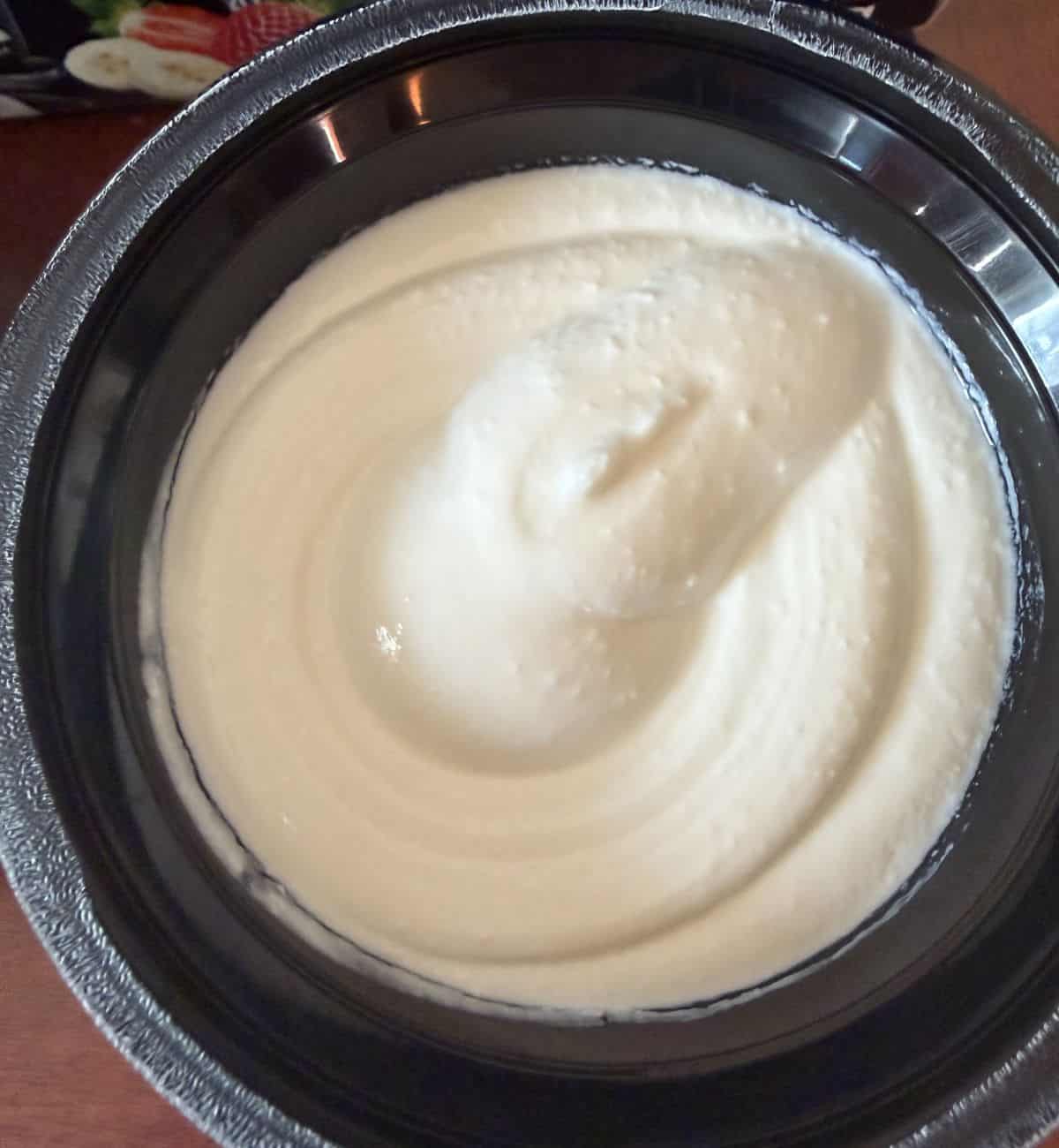 Top down image of the vanilla Greek protein yogurt opened so you can see what it looks like.