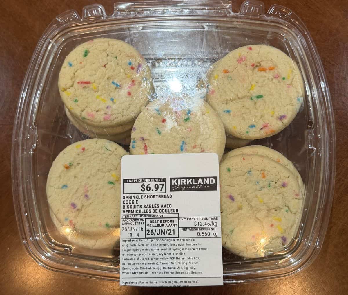 Top down image of an unopened container of the Kirkland Signature Sprinkle Shortbread Cookies on a table.
