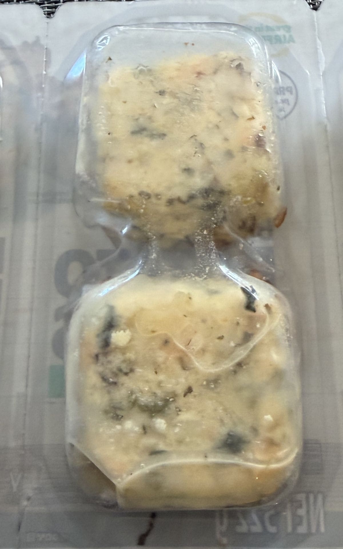 Image of two potato bakes in a plastic package unopened.