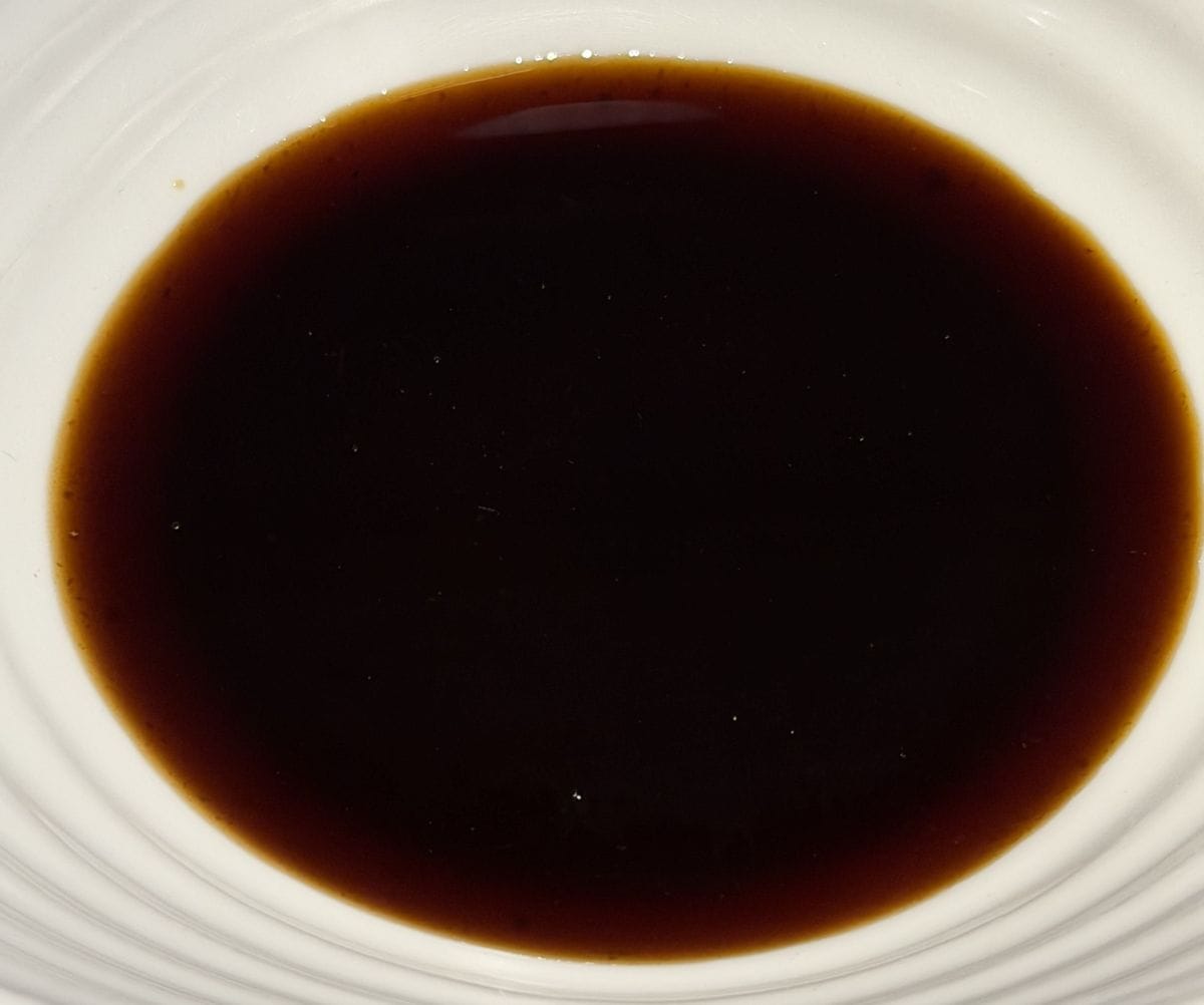 Image of the barbecue sauce served in a white bowl.