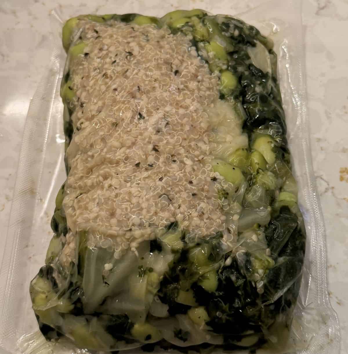 Image of one vacuum sealed package of veggies & quinoa unopened a counter.
