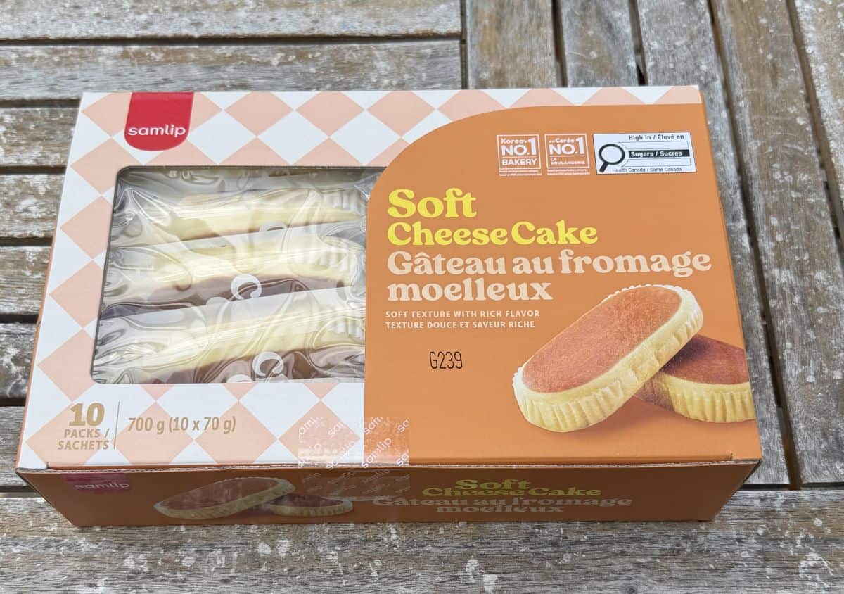 Image of the Costco Samlip Soft Cheesecake box sitting on a table outside unopened.