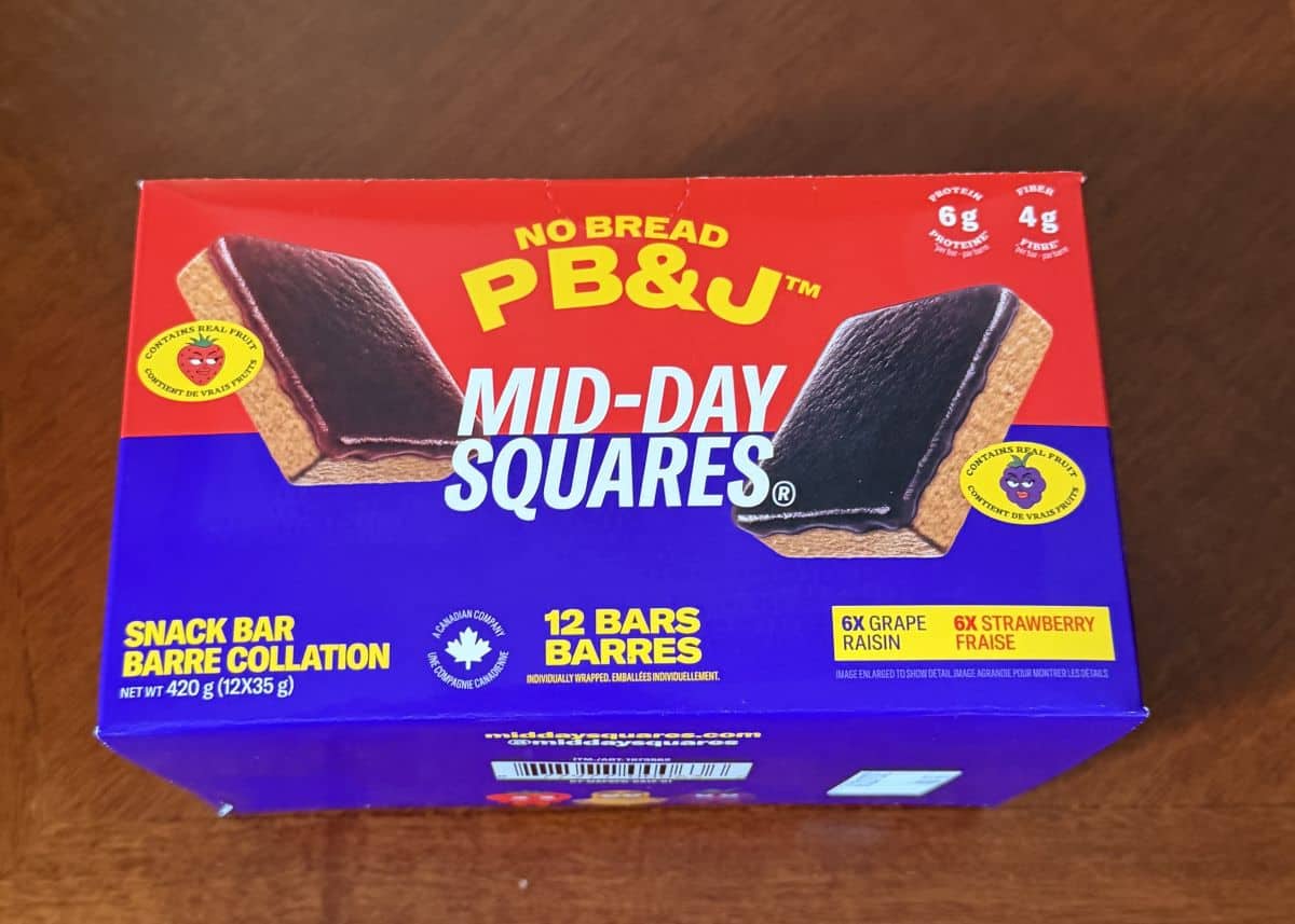 Image of the Costco Mid-Day Squares No Bread PB & J box sitting on a table unopened.