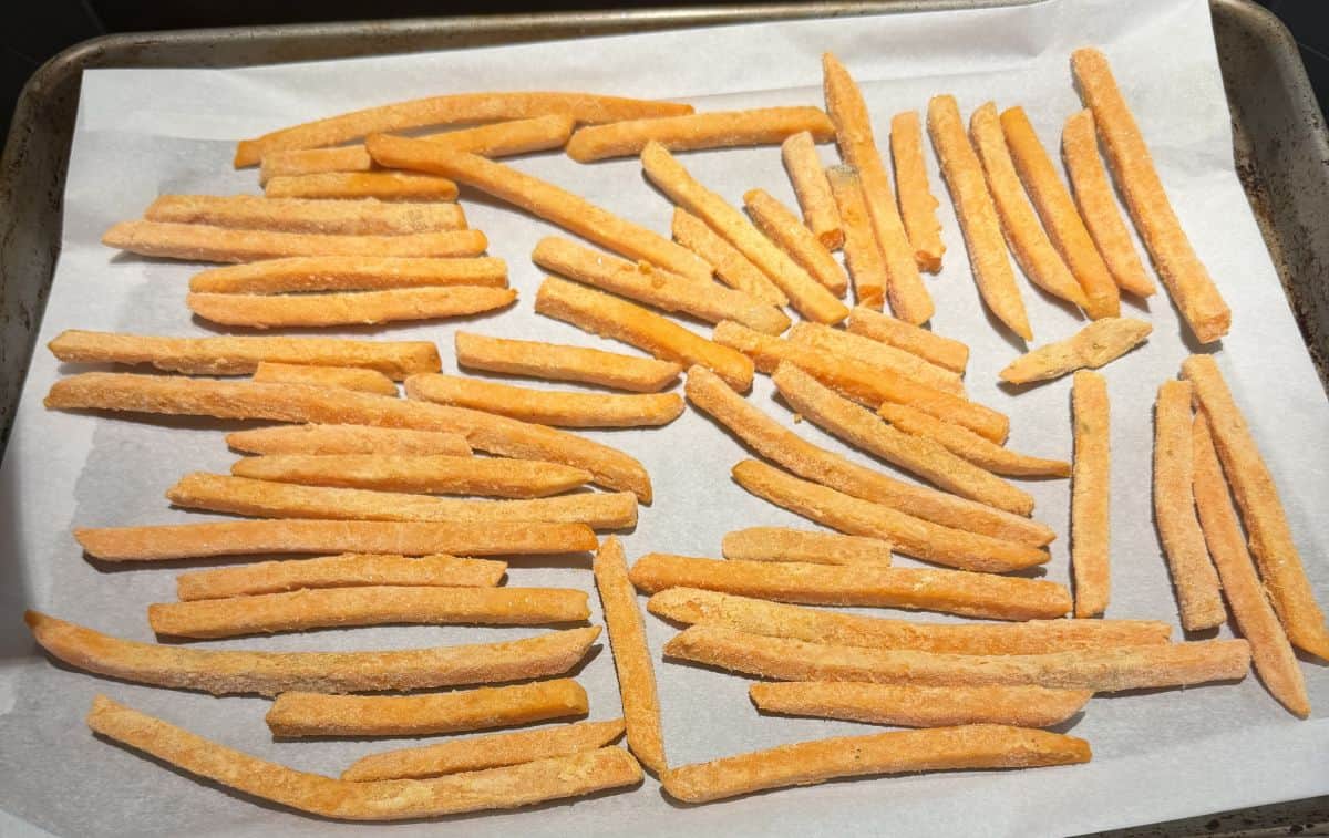 Image of the fries on a cookie sheet, frozen, before heating them.